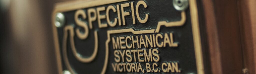 A metal plate engraved with Specific Engineering Solutions logo.