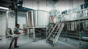 Stainless steel lauter tun with rakes and false bottom in a modern brewery brewhouse